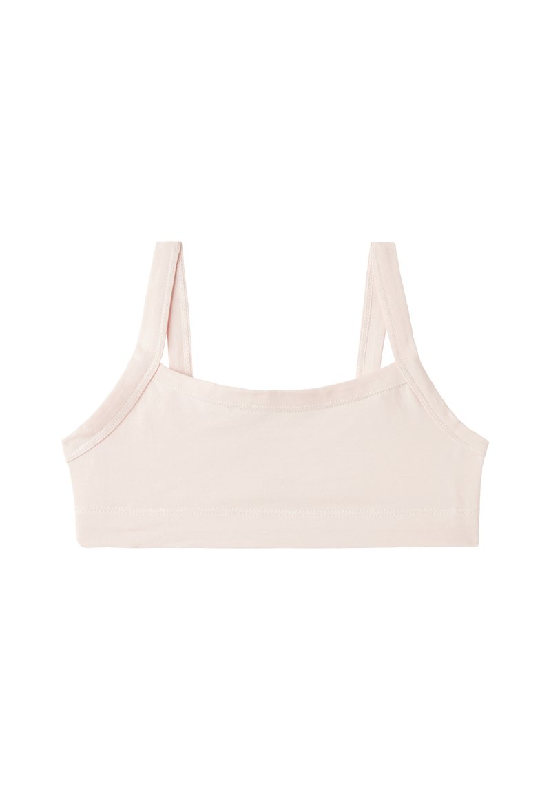 Světle růžový podprsenkový top obdélníkového tvaru, s širokými ramínky a měkkou látkou. Bezešvá konstrukce s minimálním švy a hladkou texturou.