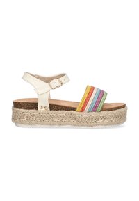 Sandalia espadrille de piel blanca con plataforma de yute trenzado, que presenta una tira tejida multicolor en rojo, amarillo, verde y azul.