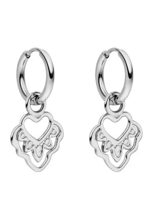 Silver hoop earrings with dangling openwork heart-shaped charms featuring decorative cutout patterns.