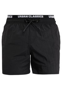 Costume de baie negre dintr-un material ușor, cu o suprafață texturată. Dispune de un talie elastică cu șnur și un logo inscripționat.