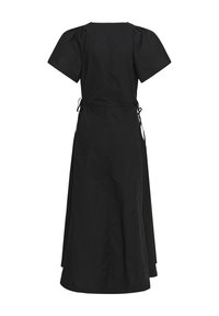 Robe midi noire avec manches courtes bouffantes, liens sur les côtés et jupe légèrement évasée, vue de dos sur fond blanc.
