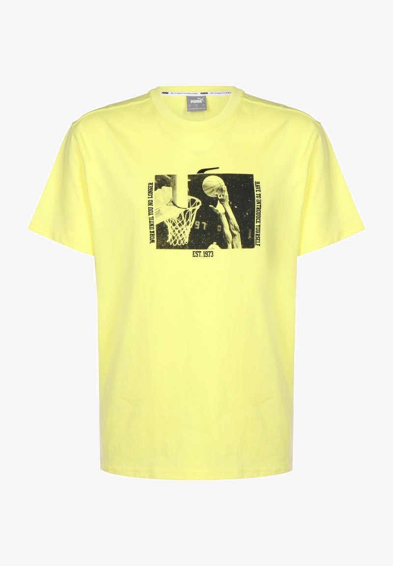 Yellow cotton t-shirt featuring a black graphic print of a basketball scene with text. Short sleeves and a standard crew neck design.