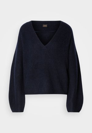 Navyblauw sweater gemaakt van zacht materiaal, met een V-hals en lange, iets geplooide mouwen. Gepersonaliseerd ontwerp met een relaxte pasvorm.