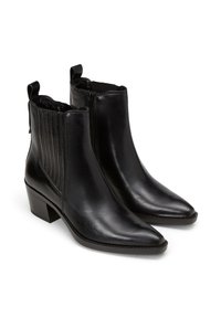 Black leather ankle boots with pointy toes, decorative side stitching, and a block heel. Features pull tabs for easy wear.