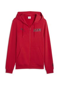 Κόκκινο φούτερ με φερμουάρ, κατασκευασμένο από απαλό ύφασμα. Διαθέτει τσέπη τύπου καγκουρό, μαύρη εκτύπωση "ACM" στο μπροστινό μέρος και λογότυπο στο μανίκι.