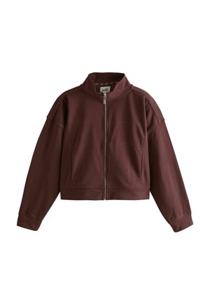 Reißverschluss-Cropped-Jacke in Dunkelbraun mit langen Ärmeln und hohem Kragen, mit sichtbaren Nahtdetails und einem Innenlabel mit Markenlogo.