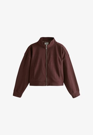 Zip-up cropped jacket in dark brown with long sleeves and a high collar, featuring visible seam details and a branded inner label.