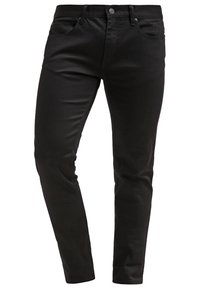 Jean noir slim en denim, avec braguette à glissière, cinq poches et détails de couture discrets. Texture lisse avec une légère brillance.