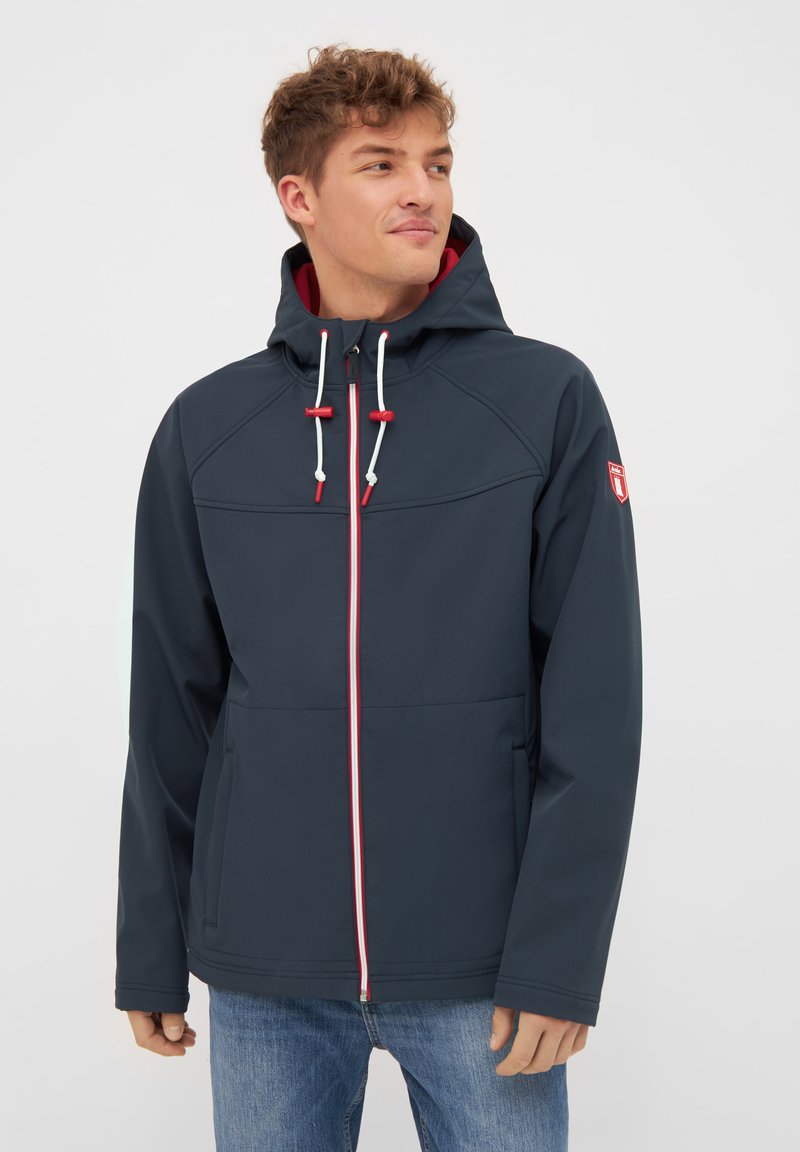 Navy waterproof jacket with a zip front and hood. Features contrasting red accents on the zipper and drawstrings, and two side pockets.