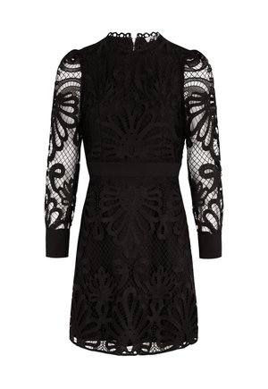 Vestido negro con un encaje superpuesto de patrones florales, mangas largas transparentes y puños sólidos. Cintura ajustada y escote redondo.