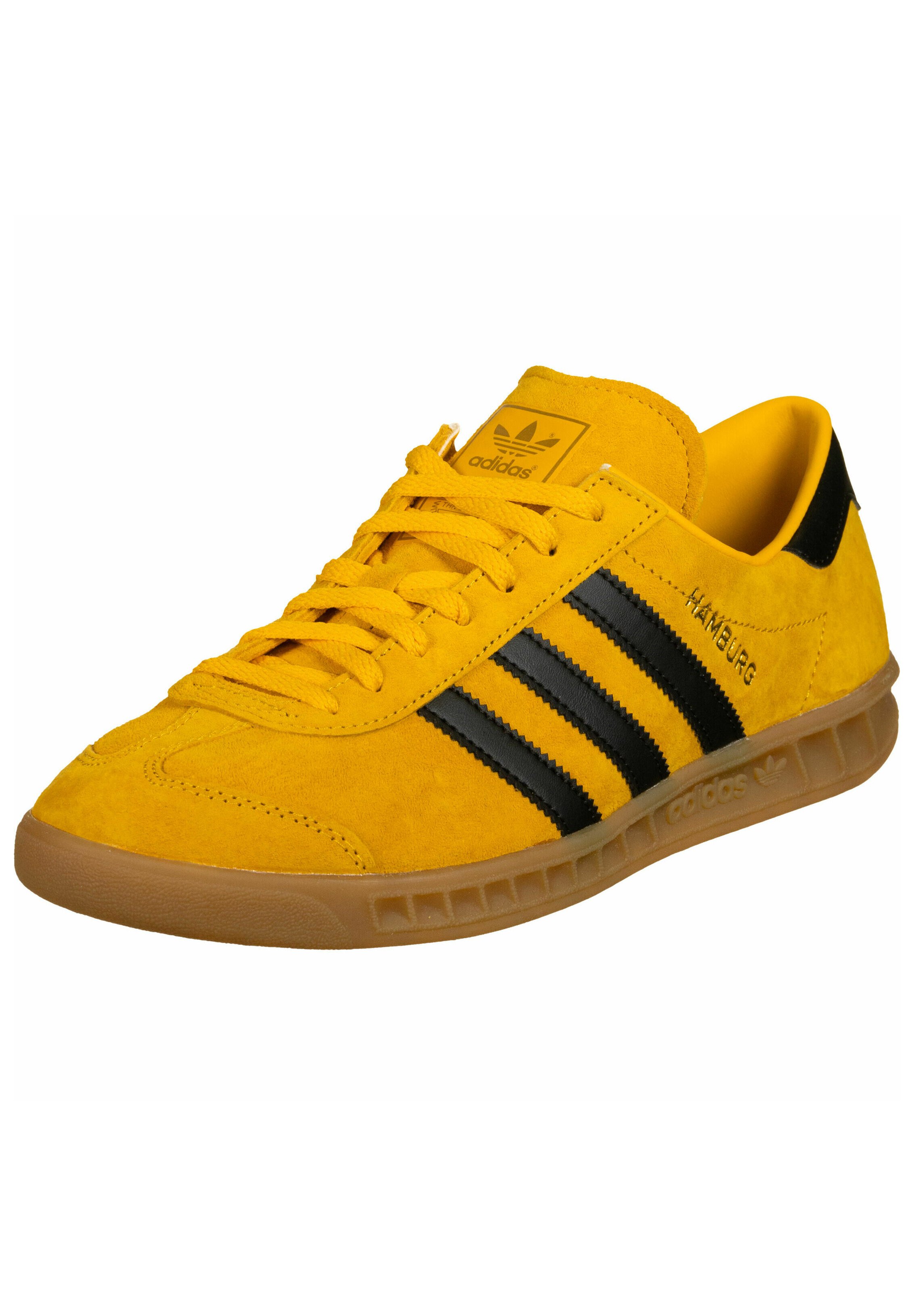 black adidas with yellow
