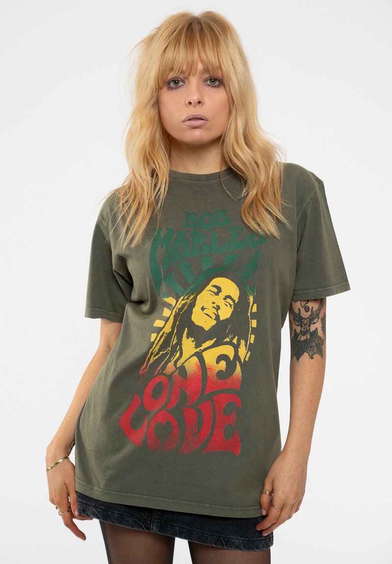 Olive green cotton t-shirt featuring a Bob Marley graphic, with red and yellow text reading "ONE LOVE" and bold patterned accents.