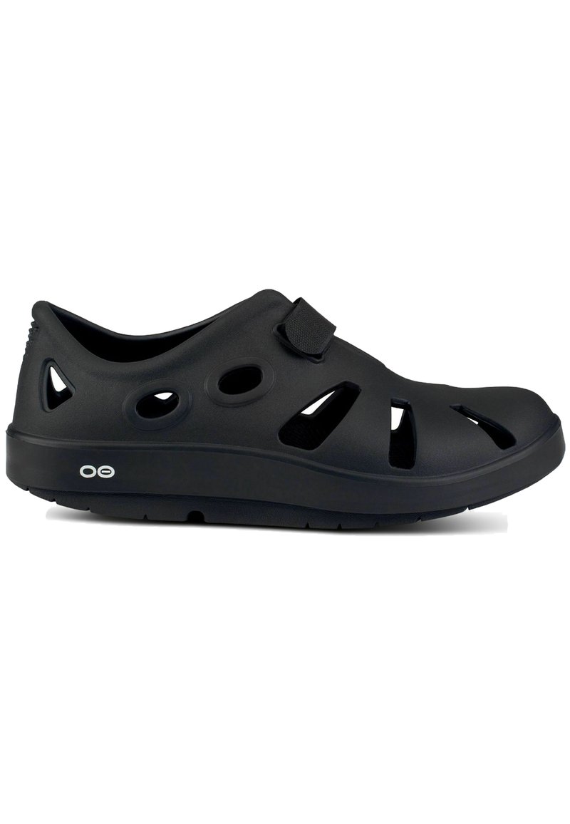 Black clogs with ventilation holes, made from lightweight material. Features a Velcro strap and contoured sole for comfort.