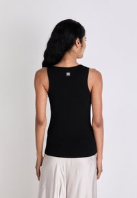 HUGO SHARPIN - Top - black