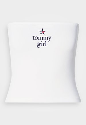 Bílý top bez ramínek s nápisem "tommy girl" v námořnické modři a červenou hvězdičkou jako akcentem. Vyrobený z hladkého, elastického materiálu, přiléhavý střih.