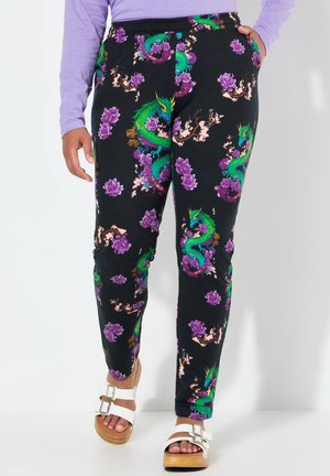 Leggings noires avec un impression vibrante de dragon et de fleurs violettes. Fabriqués en matière douce, dotés d'une taille élastique et de poches latérales.