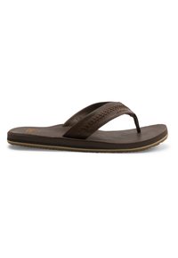 Brune skinnflip-flops med en teksturert flettet stropp, flat såle og subtil logo. Lett design og enkle sømdetaljer.