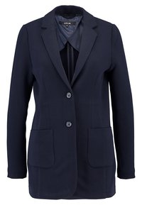 Námořnický blazer z texturované tkaniny, s klopovým límcem, dvěma předními kapsami a zapínáním na dva knoflíky. Hladká vnitřní podšívka.