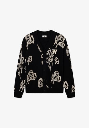 Mustast materjalist kardigan valge lillemustriga, millel on V-kaelus, nööpidega kinnine ja rinnal logo. Valmistatud pehmest materjalist.