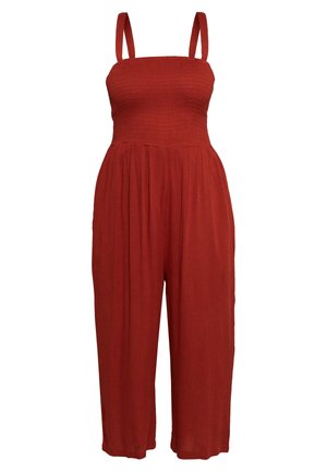 Bezrękawny kombinezon w kolorze rdzawej czerwieni z dopasowanym, marszczonym gorsetem i szerokimi, skróconymi nogawkami.