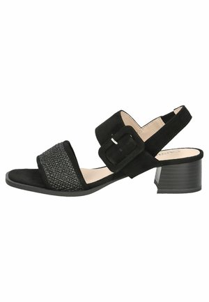 Black sandal featuring a textured front strap, smooth suede material, ankle strap with a square buckle, and a low block heel.