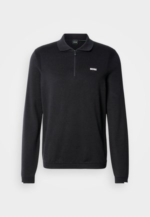 Black long-sleeve polo shirt with a zip collar, ribbed texture, and a small white "BOSS" logo on the chest.