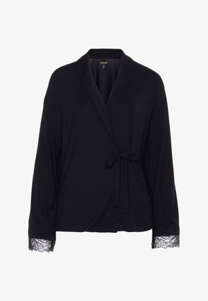 Czarna bluzka na zakładkę z długim rękawem, kołnierzem w stylu szalowym, wiązaniem po boku oraz koronkową lamówką na mankietach.