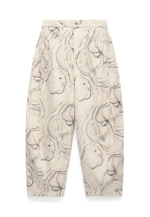 Beige pants with loose fit and high waist, featuring black abstract floral sketch pattern, front pockets, button, and zipper closure.
