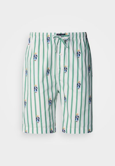 A zöld-fehér csíkos rövidnadrág puha anyagból készült, rugalmas derékrésszel, és apró, mosolyogó mackóminták vannak egyenletesen elosztva a mintázatban.