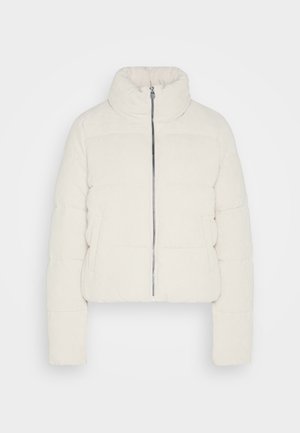Veste rembourrée courte en velours côtelé crème, dotée d'un col montant, d'une fermeture éclair à l'avant et de deux poches latérales avec une surface texturée.
