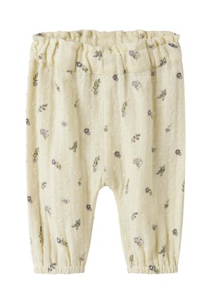 Pantalons bébé doux de couleur crème avec de petites imprimés floraux violets et verts, dotés d'une ceinture élastique et de poignets aux chevilles.