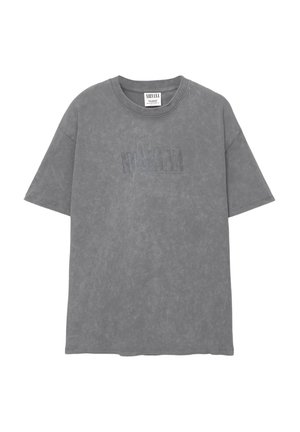 Gray cotton T-shirt with short sleeves, regular fit, featuring a faded "Nirvana" logo in a slightly darker shade. Soft texture, simple design.