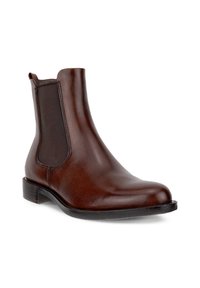 Brown leather Chelsea boot with elastic side panel and low stacked heel on a white background.
