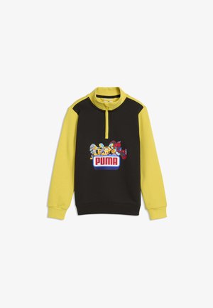 Børns sort og gul langærmet pullover med kvart lynlås og farverigt Puma-logo med tegneseriefigurer på brystet.