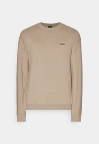 Beige knitted sweater with a round neck, long sleeves, and textured pattern on shoulders, featuring a small black "BOSS" logo on chest.