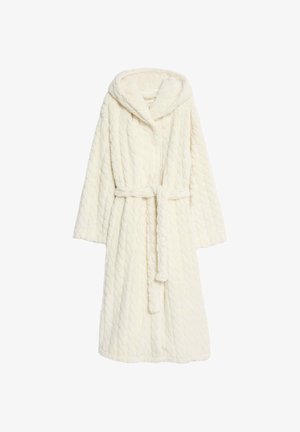 Quiltad, krämfärgad badrock med huva, långa ärmar, midjeband och mjuk textur. Har ett kabelstickat mönster över hela.