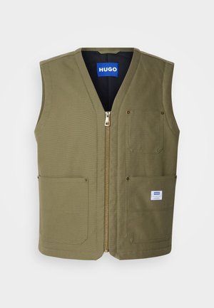 Olive-green sleeveless vest with a zip front, two large front pockets, and a small label on the bottom right. Textured fabric with a clean design.