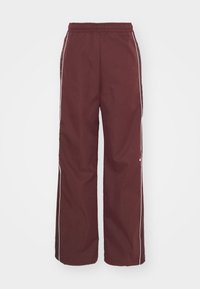 Burgundské lehké sportovní kalhoty s elastickým pasem, bílými postranními pruhy a logem v dolní části přední strany, s volným střihem.