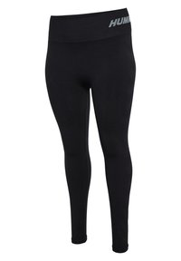 Svarta leggings i elastiskt tyg, med bred midja som har "HUMMEL"-logotypen i ljusgrått, slät textur och åtsittande passform.