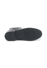 Zwarte laarszool met gestructureerde gripzones en "Nine West" branding op de hiel en de bal van de voet.