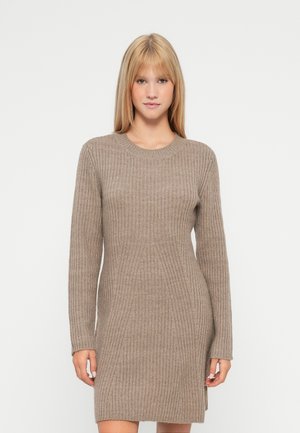 Knit sweater dress in light brown, featuring ribbed texture, round neckline, and long sleeves with side slits at the hem.