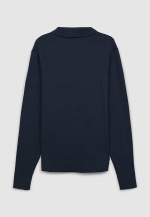 Polo a maniche lunghe blu navy con colletto, polsini a costine e orlo aderente. Realizzato in un tessuto liscio e morbido con cuciture minime.