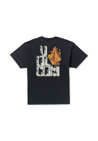 T-shirt noir à manches courtes avec un grand imprimé graphique au dos, comportant des éléments blancs, jaunes et rouges, représentant du texte stylisé et une forme de diamant.