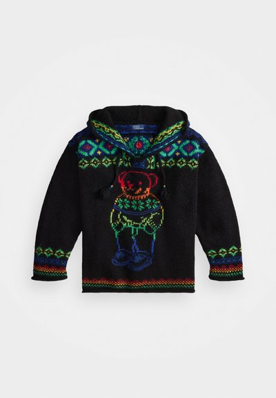 Μαύρη κουκούλα με πολύχρωμα πλεκτά σχέδια. Διαθέτει γραφικό αρκούδας σε ζωντανά χρώματα. Σχοινιά στο λαιμό και πλέκτο μανίκι.