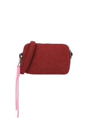 Red suede crossbody bag with a zipper closure, contrasting pink cord strap, and smooth surface. Compact rectangular shape.
