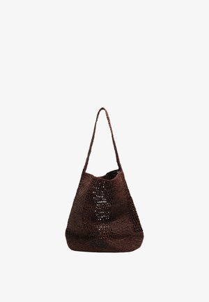 Brown crocheted shoulder bag with an open weave pattern and a single long strap, standing upright on a white background.