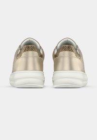 Metallic beige sneakers with mesh accents at the heel and a white sole. Smooth texture and rounded shape with a cushioned collar.