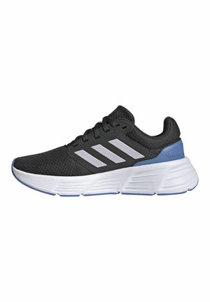 Black athletic sneaker with white sole, blue heel detail, and three white stripes on side, viewed from outer side.