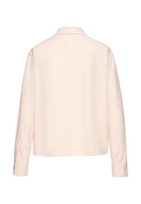 Light pink collared shirt with long sleeves, a relaxed fit, and buttoned cuffs. Smooth texture with a simple, classic design.