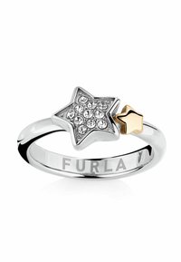 Silverfärgad stjärnformad ring med kristalldetaljer och en liten guldfärgad stjärna. Engraverat varumärke "Furla" på den inre bandet.